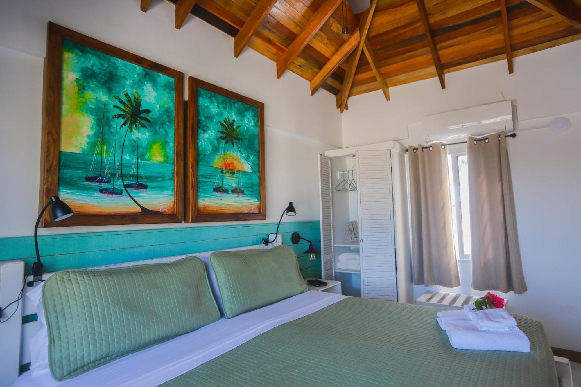 Treetops Hotel Caye Caulker Rom bilde